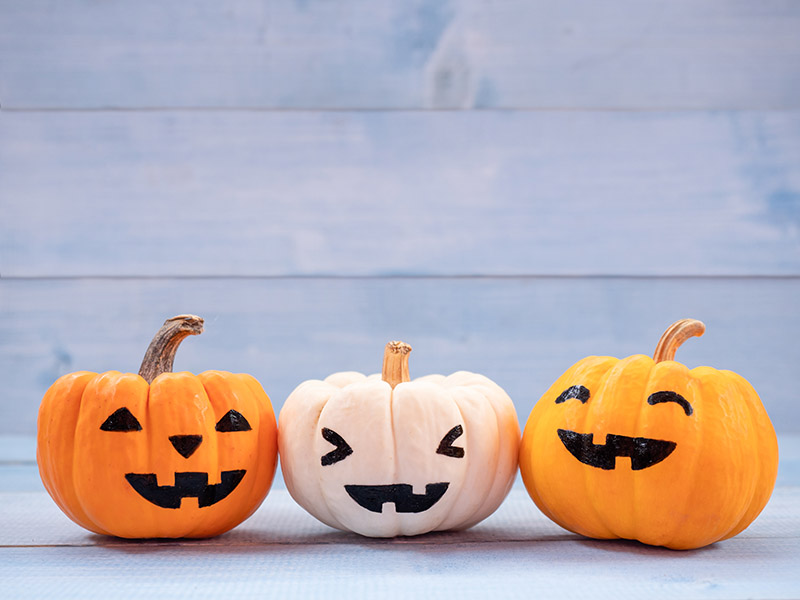 three small jack-o-lanterns with cute expressions
