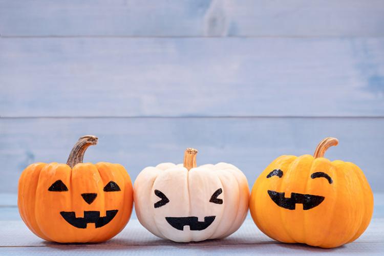 three small jack-o-lanterns with cute expressions