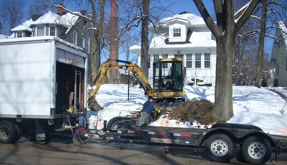 Backhoe Arrives to Start Digging Water Lines